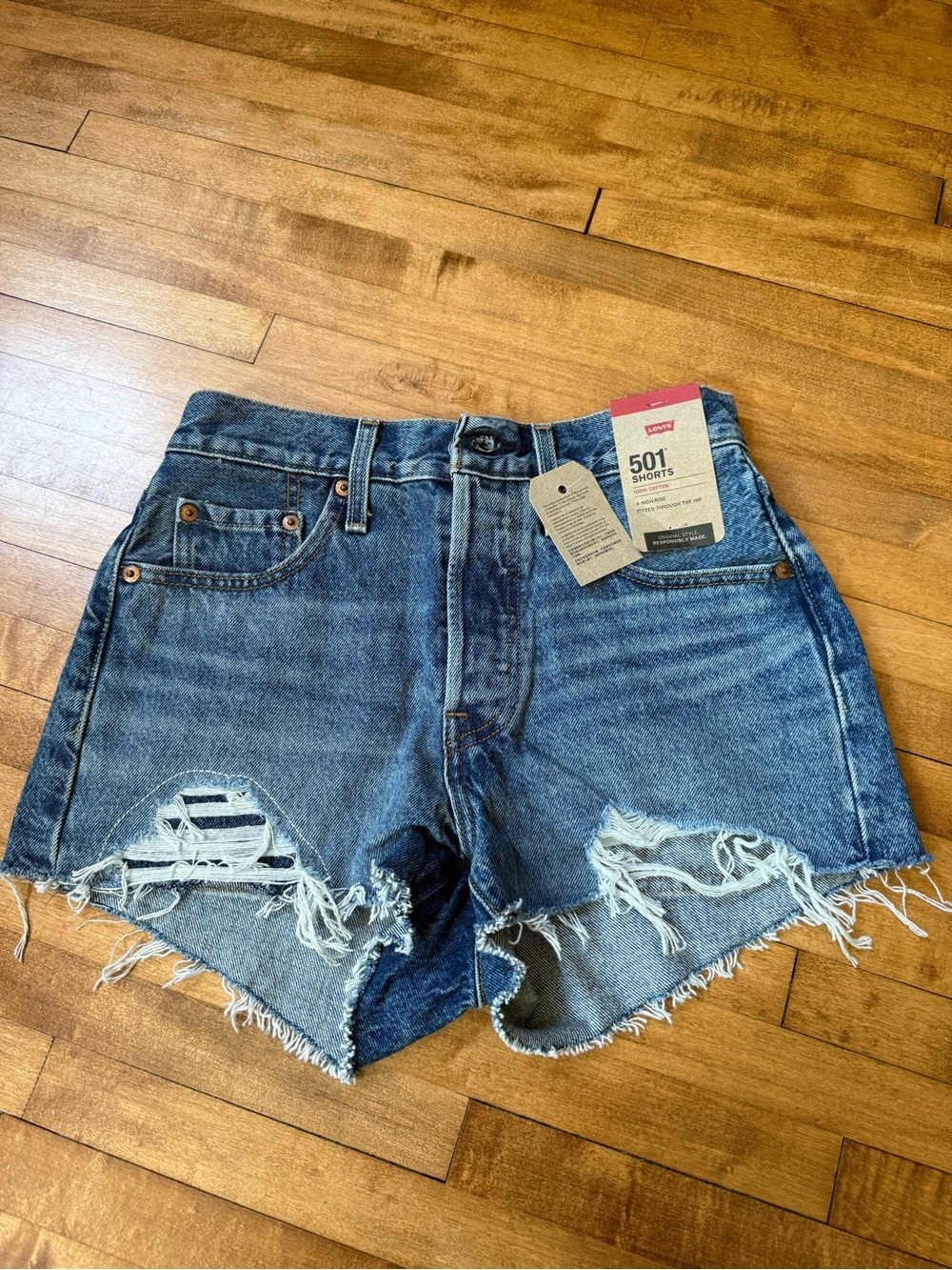 Levi's Denim Cutoff Shorts in Medium Blue with Distress